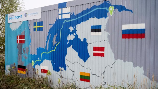 “Nord Stream 2 Committed. Reliable. Safe.” hangs above a painted map at the natural gas receiving station in in Lubmin, Germany.