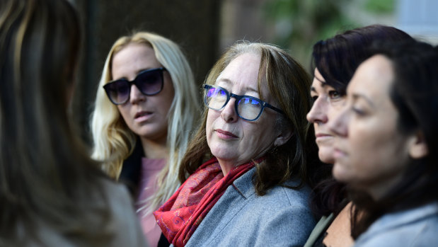 Samantha Knight's mother Tess Knight , centre, speaks outside court on Monday.
