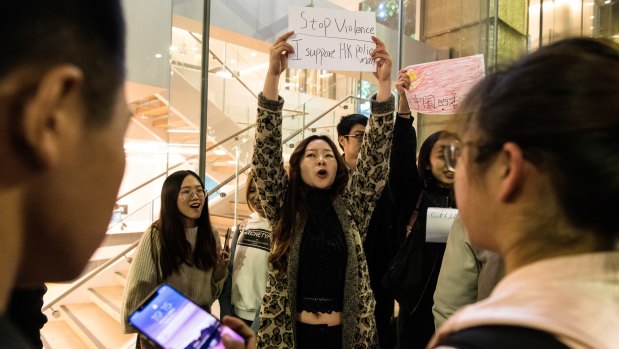 Pro-China supporters stationed themselves near the protest, declaring their support for Hong Kong police.