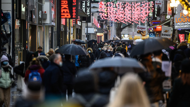 People walking past shops on a central shopping street during the second wave of the coronavirus pandemic in Cologne on Friday.