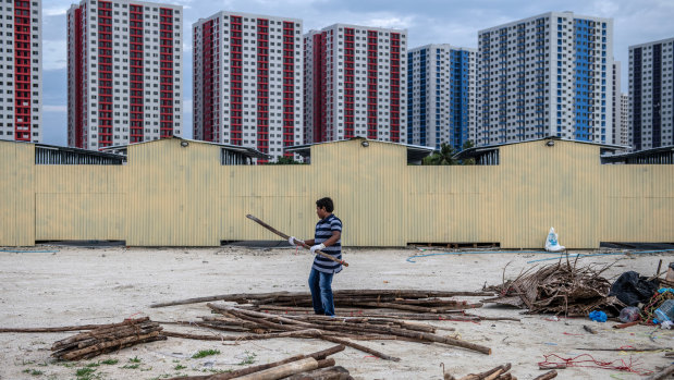 Newly-constructed apartment blocks stand on artificial islands up to three metres above sea level as the Maldives seek to mitigate climate change and rising sea levels.