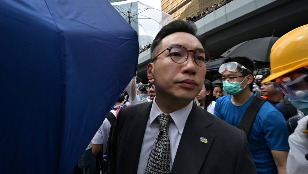 Hong Kong democrat Alvin Yeung walks past as protesters occupy the roads near the Legislative Council and government headquarters on June 12.