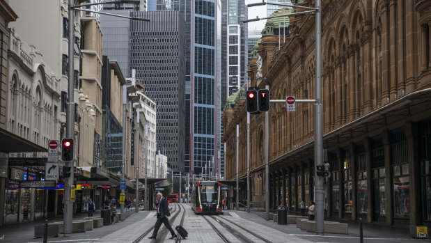 The virus has left city offices and streets such as Sydney's George Street empty. 