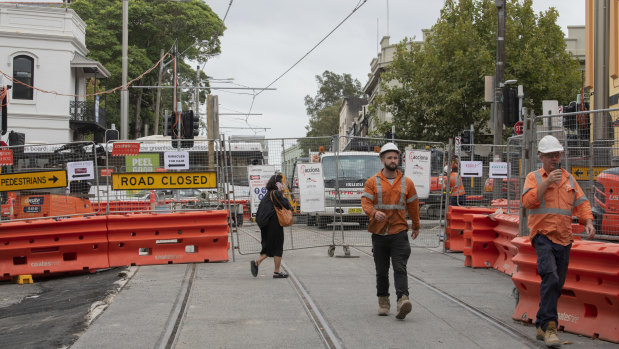 Barriers remain along much of Devonshire Street in Surry Hills more than three months after they were supposed to be removed.
