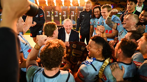 Michael Maguire and the Blues celebrate a remarkable and rare Origin series deciding win in Brisbane in 2024.