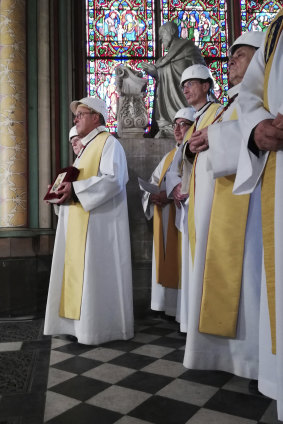 Priests attend a service led by Archbishop of Paris Michel Aupetit.