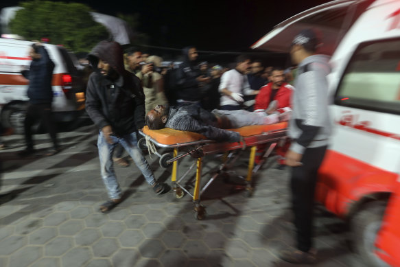 Palestinians wounded in the Israeli bombardment of the Gaza Strip are brought to Al Aqsa hospital in Deir al Balah, Gaza Strip.