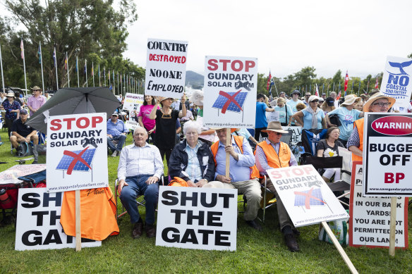 Prominent among the protesters were banners against wind and solar projects.