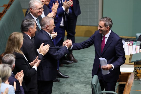 Anthony Albanese shakes hands with Treasurer Jim Chalmers after the budget speech.