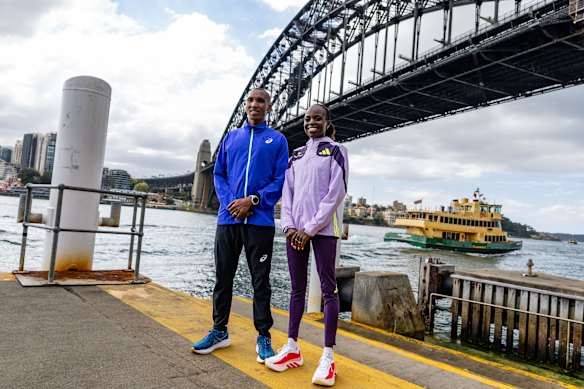 Alphonce Simbu and Peres Jepchirchir during the Sydney Marathon press conference.
