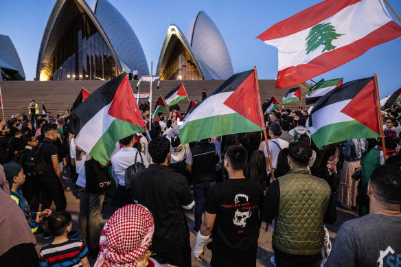 Pro-Palestinian protestors gather at the Sydney Opera House to demonstrate against the Sydney Opera House being lit up in blue and white in support of Israel.