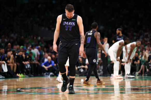 Luka Doncic #77 of the Dallas Mavericks reacts to a bad play.