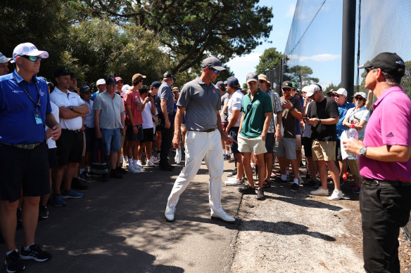 Adam Scott walks to his errant drive on the seventh hole.