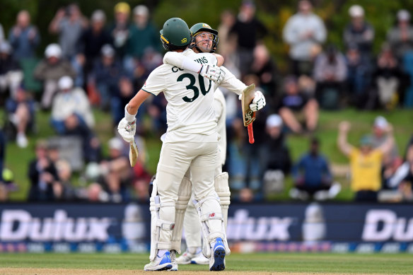 Pat Cummins and Alex Carey celebrate victory in Christchurch.