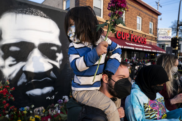 People gather outside Cup Foods in Minneapolis to celebrate the murder conviction of former police Officer Derek Chauvin in the killing of George Floyd.