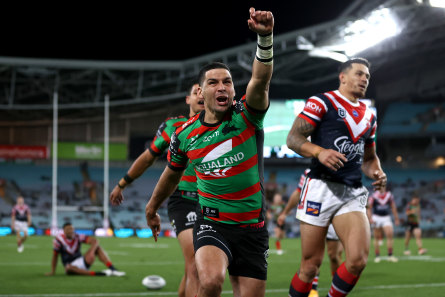Rabbitohs five-eighth Cody Walker celebrates scoring a try against the Roosters on Friday night.