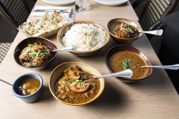 Lunch at Spiced by Billu’s:  (clockwise from top left) garlic naan, basmati rice, kadhai chicken, dhal makhani, Delhi goat curry, spicy mango chutney, and eggplant masala  (clockwise from top left) 