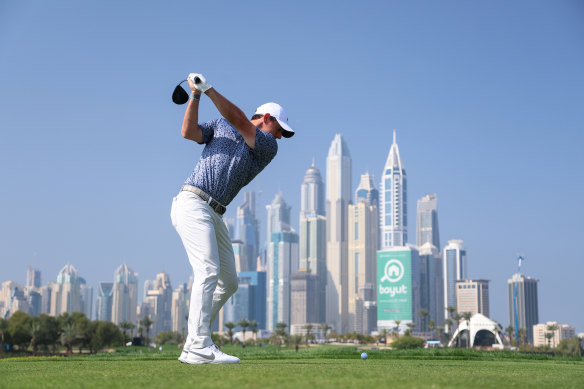 Rory McIlroy tees off in eighth place during his final lap in Dubai.