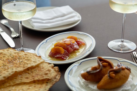 Yellowfin tuna crudo and mozzarella in carrozza, with a side of pane carasau.