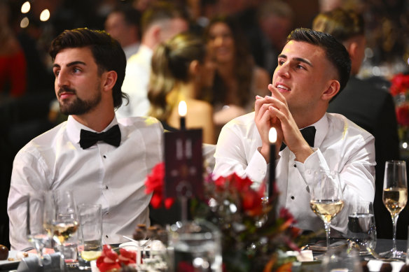 Josh Daicos takes a keen interest in the count, with brother Nick Daicos by his side.