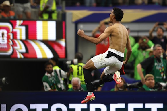 Hossam Abdelmaguid celebrates after scoring the winning penalty.