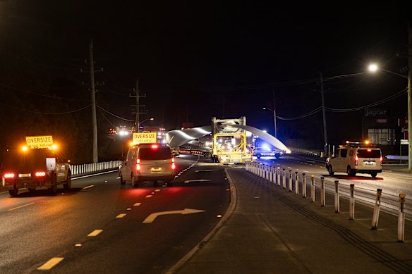 The turbine blade crosses the highway from the wrong side on its journey from the Port of Newcastle to the wind farm.