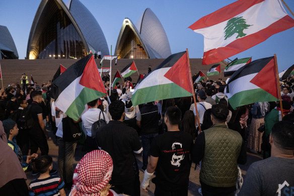 Palestinian supporters gathered outside the Opera House on October 9 after it was lit up in Israeli colours following the Hamas attack.