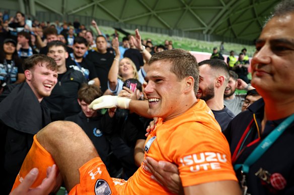 Harrison Devenish-Meares celebrates with Sydney fans after their Big Blue win over Melbourne Victory in the A-League’s elimination finals.