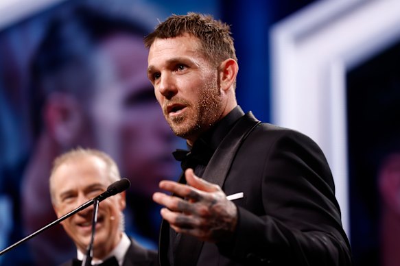 Dane Swan addresses the room in 2024.