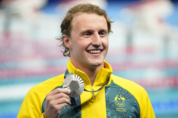 Elijah Winnington proudly displays his silver medal.