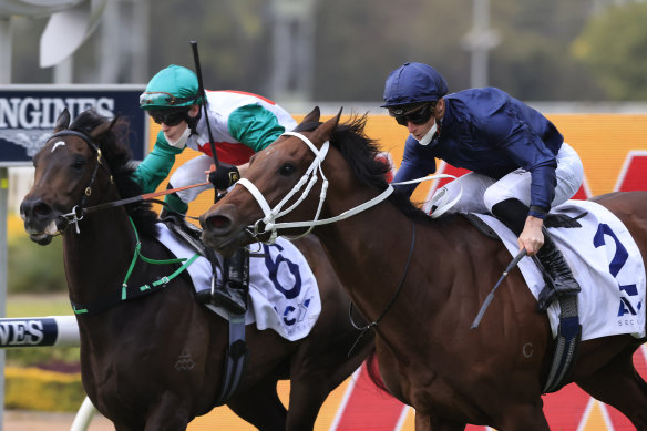 Head Of State looms up to Profondo in the navy jacket of Coolmore to win the Gloaming Stakes