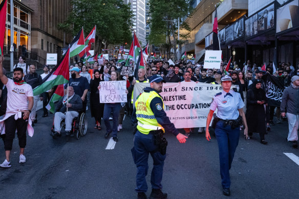 Pro-Palestinian protesters march through Sydney on Monday. Activists  will defy warnings from NSW Police and rally again in Sydney’s Hyde Park on the weekend.