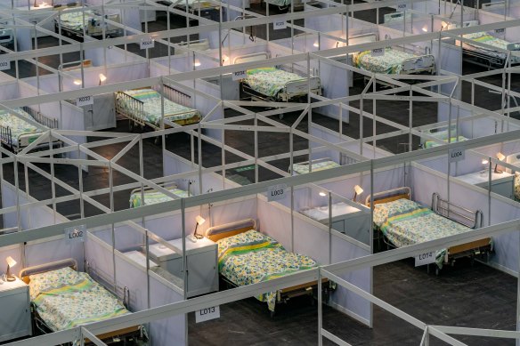 Beds are seen at a temporary field hospital set up at the Asia World Expo hall in Hong Kong in preparation for a third wave of COVID-19.