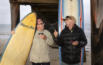 Lifelong mates: Point Lonsdale Boardriders Club veterans Rodney Nicholson (left) and Graham Slade share a cup of tea.