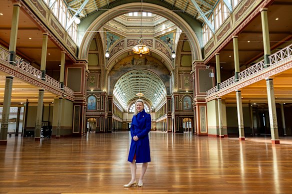 Museums Victoria’s Michelle Stevenson inside the Royal Exhibition Building. Its ornate interior murals were painted for the 1901 Federation event.