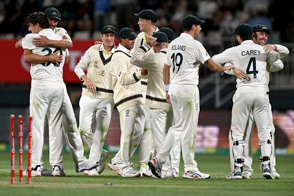 The Australians enjoy the moment after winning the fifth Test at Blundstone Arena.