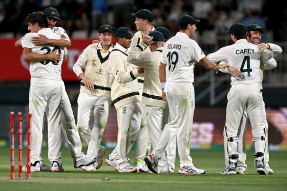 The Australians enjoy the moment after winning the fifth Test at Blundstone Arena.