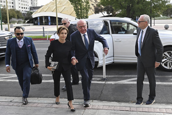 Rupert Murdoch (centre) and his wife Elena Zhukova Murdoch arrive at the Second Judicial District Court in Reno, Nevada on September 16, 2024. 