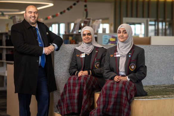 Islamic College of Melbourne principal Dr Abdul Kamareddine with year 11 students Sumaiyya Baloch and Rahemah Danish.