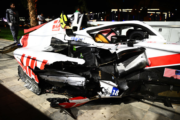 The wrecked car of Mick Schumacher on the side of the track after a crash. 