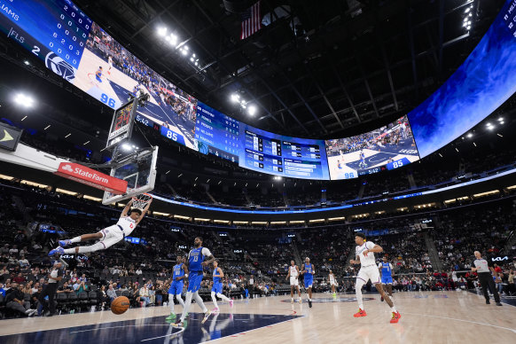 Los Angeles Clippers’ Cam Christie (12) throws down a dunk at the Intuit Dome during preseason.