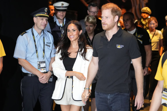 Britain’s Prince Harry, right, and Meghan, Duchess of Sussex, arrive to a wheelchair basketball match at the Invictus Games in Duesseldorf, Germany, September 2023