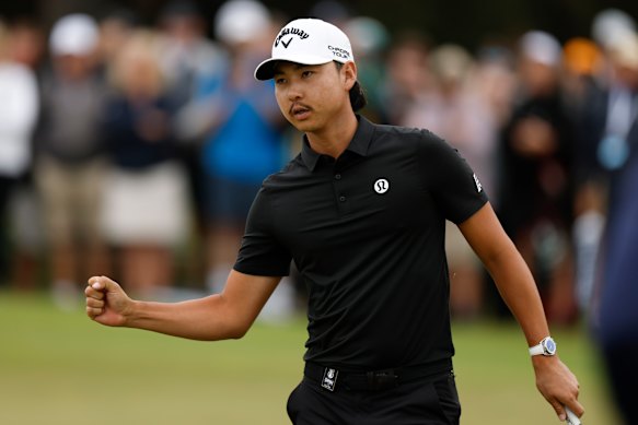 Min Woo Lee of Australia reacts after birdie.