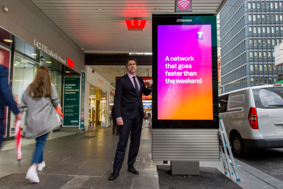 Councillor Nicholas Reece with one of the digital billboards.