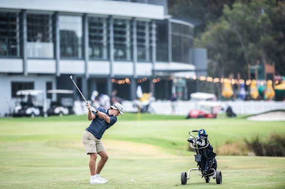 Ryan Papenhuyzen is playing plenty of golf in retirement. He hits a shot into the 18th green at Wollongong Golf Club. 