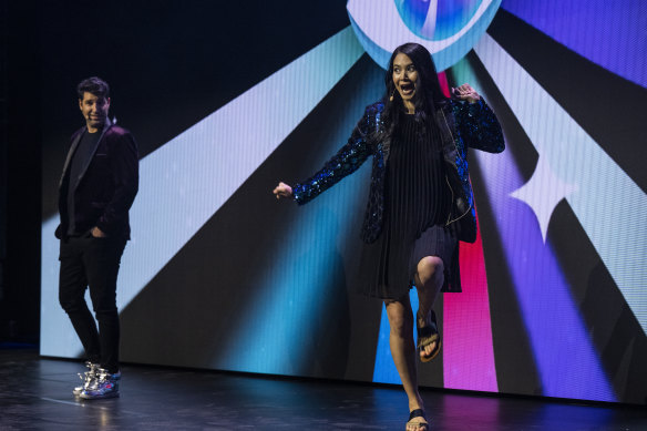 Two of the three Canva co-founders Cliff Obrecht and Melanie Perkins celebrate on stage at an event in Sydney last month.