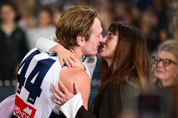 Tom Stewart of the Cats is greeted by his wife Emma before his 200th game.