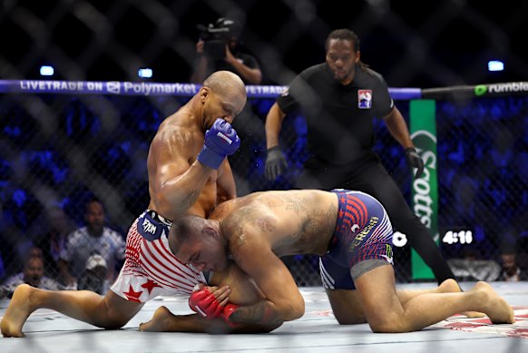 Ciryl Gane of France strikes Alex Pereira during their short bout. 
