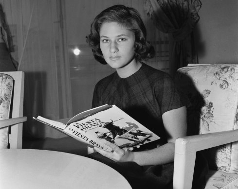 Princess Fazile, 16-year-old fiancee of King Faisal of Iraq, reading a book sent by her future husband in her apartment in Paris, 1957.