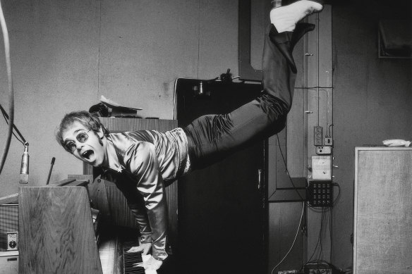 Elton John performing a handstand on his piano in London, 1972.  